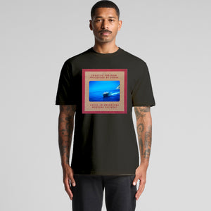 Man wearing a black t-shirt with a graphic design on a gray background