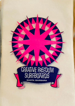 Logo of Creative Freedom Surfboards with pink and blue design on a beige background