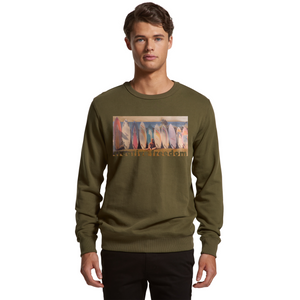 Man wearing a green sweatshirt with a graphic design on a white background