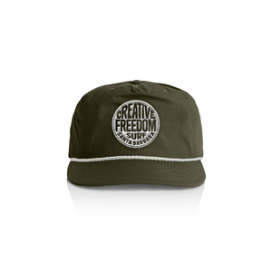 Green cap with 'Creative Freedom Surf Santa Barbara' logo on a white background