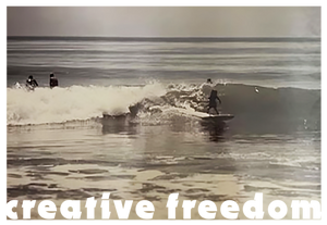 Vintage-style photo of people surfing with 'creative freedom' text overlay.